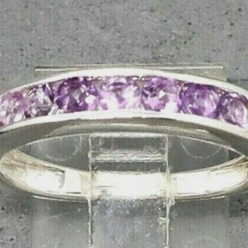 Chuck Clemency 7 Stone Lavender Amethyst Band RingThis pink crystal is thought